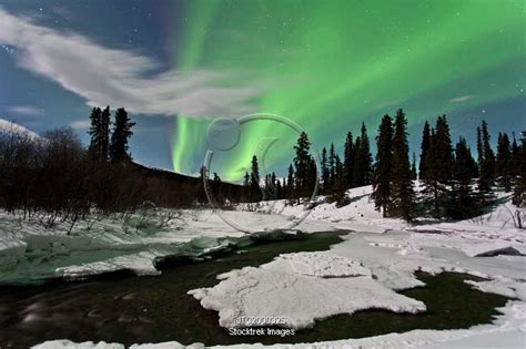 Aurora Borealis Over Creek Yukon Canada Stocktrek Images