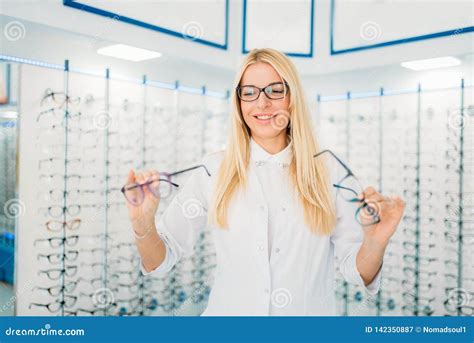 Female Optician Against Showcase With Glasses Stock Image Image Of Choosing Optometry 142350887