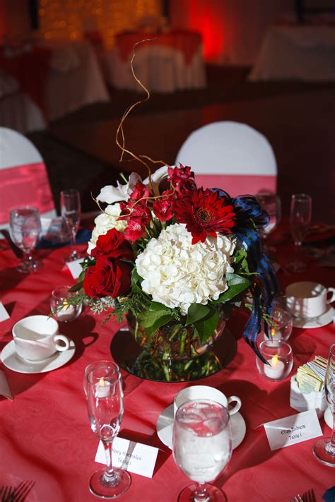 Red, white, and blue receive equal representation at the party's entrance. Beautiful centerpieces for tables at reception- color ...