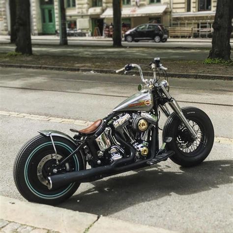 A Black And Silver Motorcycle Parked On The Street