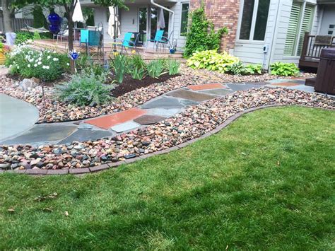 Father & son landscaping provides a full range of landscaping services, including landscape design & installation, hardscapes, irrigation & sodding. Flagstone Pathway with River Rock edging - TJN Enterprises ...