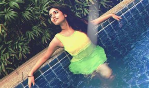 Malayalam Actor Priya Prakash Varrier Looks Smoking Hot In Yellow Swimsuit As She Takes A Dip In