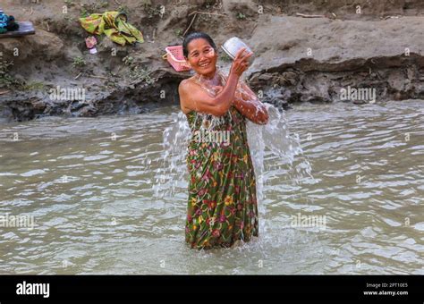 Burmese Woman Bathing And Washing During Southeast Asia Heatwave Life