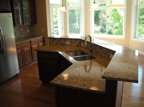 It isn't my personal favorite, but i get why people want it there. sink and dishwasher in island-very close to what I want ...
