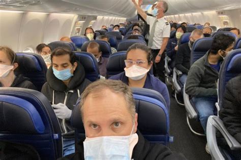 passenger ‘shares pic from united flight showing crowded plane and asks if company is “relaxing