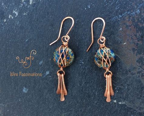 The Earrings Are Made With Copper Wire And Glass Beads