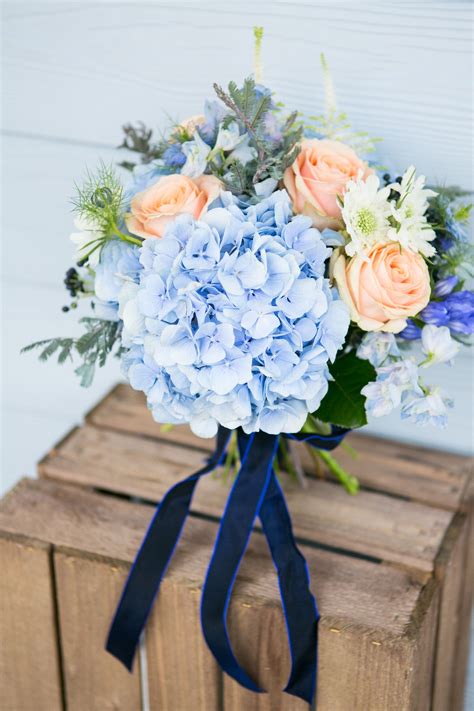 Choosing a wedding bouquet is a huge and important part of wedding preparations. www.blueskyflowers.co.uk | Peach wedding bouquet, Blue ...