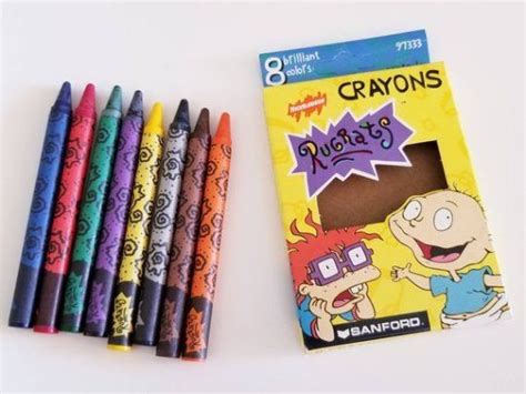 Crayons Are Laying Next To Each Other On A Table With The Package In Front