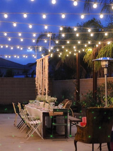 A small outdoor entertaining deck in sydney is illuminated by lights in the evening. Sets Decoration Ideas for Romantic Outdoor Dining Room ...