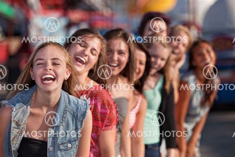 Group Of Girls Laughing By Creatista Mostphotos