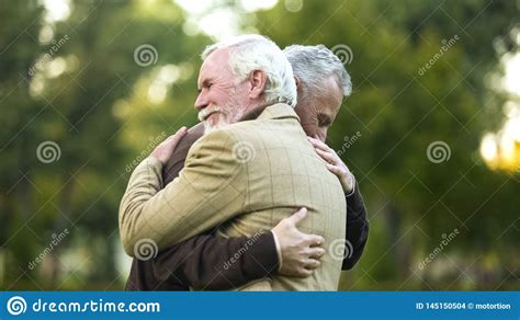 Mature Men Hugging, Happy To See Each Other, Old Friends Meeting