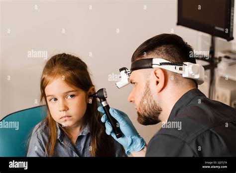 Otoscopy Of Child Ears With Otoscope Ent Doctor Consultation With