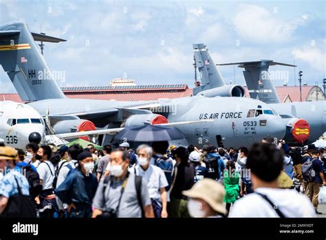 Festival guests tour static displays of different types of aircrafts at