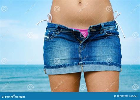 Lady On Beach Is Undressing Her Skirt With Zipper Opened Stock Image