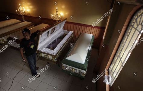 Filipino Funeral Worker Arranges Coffins Hong Editorial Stock Photo