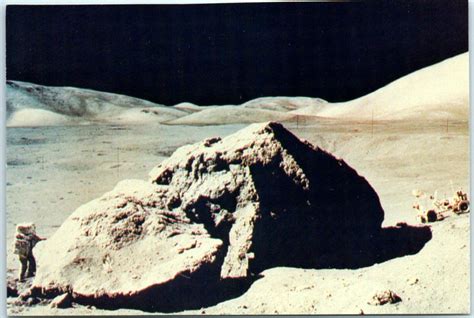 Lunar Module Pilot Harrison H Schmitt Standing Next To A Lunar Boulder