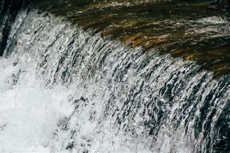 Close Up Of A Cold Stream Of Fresh Water From Mountain River Rapids