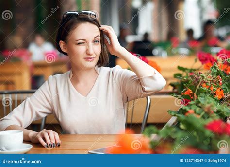 Young Woman Drinks Coffee In Cafeteria And Posing With Sunglasses Stock Image Image Of Posing