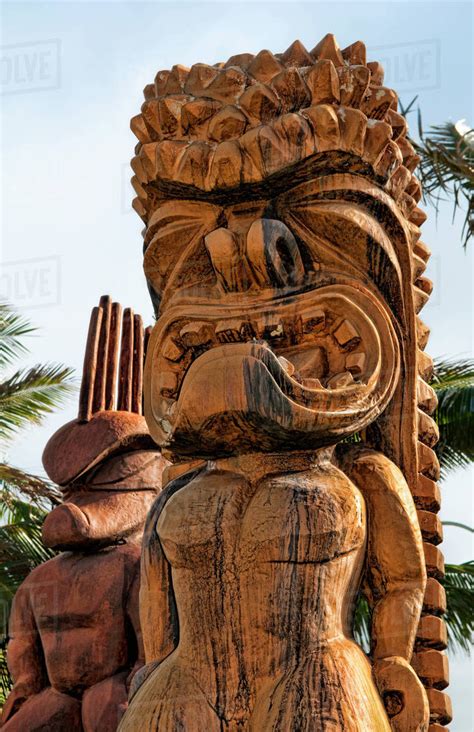 Hawaii Oahu Large Wooden Tiki Statues Greet Visitors Outside Of The