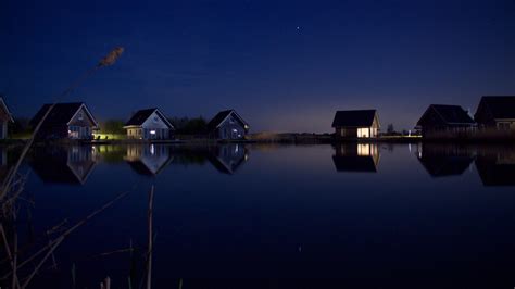 1920x1080 Houses At Lake Water Starry Night 1080p Laptop Full Hd