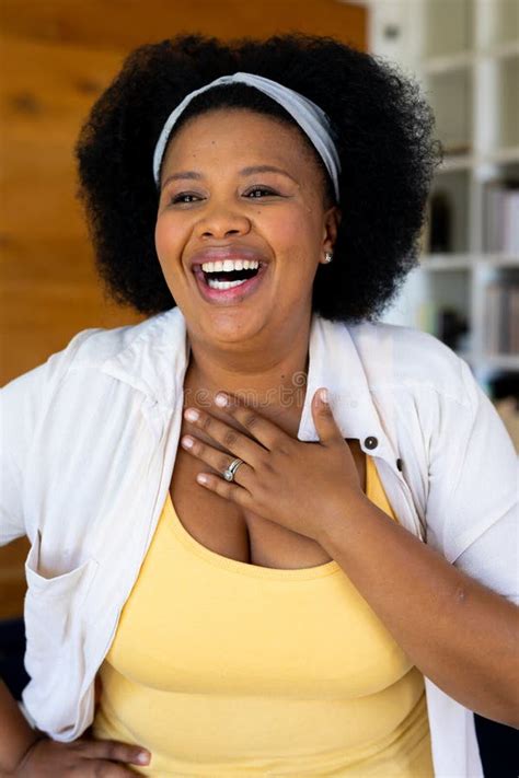 Happy Plus Size African American Woman Looking Away And Laughing Stock