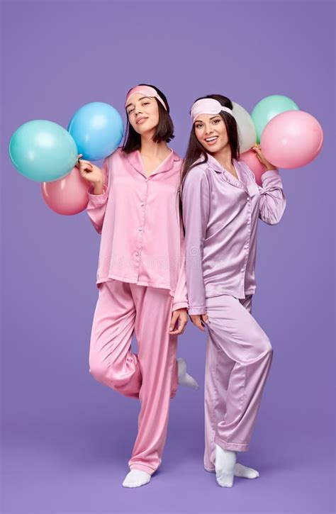 Friends With Balloons During Pajama Party Stock Photo Image Of