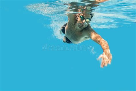 Pro Male Swimmer In The Swimming Pool Underwater Swim Photo With Copy