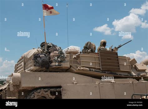 An M1a2 Abrams Tank Crew From Company B 3rd Battalion 8th Cavalry
