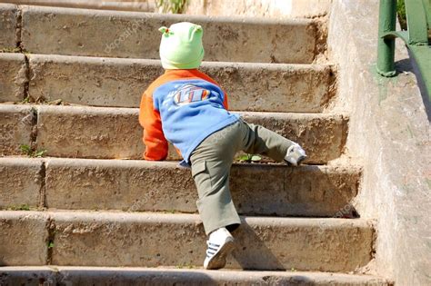 Child Climbs Up The Stairs — Stock Photo © Vlad Nikon 32553259