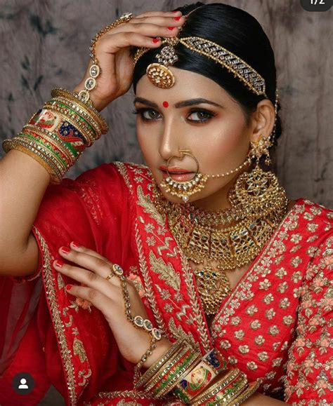 beautiful girl in india nath nose ring red lehenga bridal photoshoot blush bride hair and