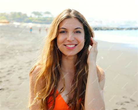 Premium Photo Portrait Of Smiling Beautiful Sensual Girl In Orange