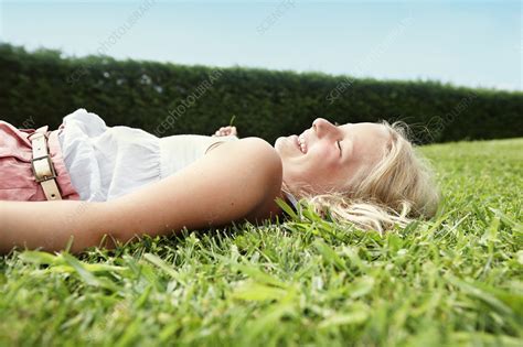 Smiling Girl Laying In Grass Stock Image F0049702 Science Photo Library