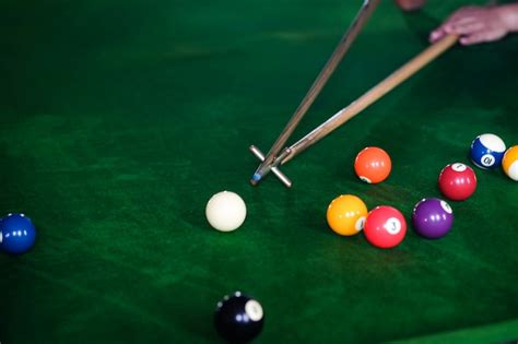 Premium Photo Mans Hand And Cue Arm Playing Snooker Game Or Preparing Aiming To Shoot Pool