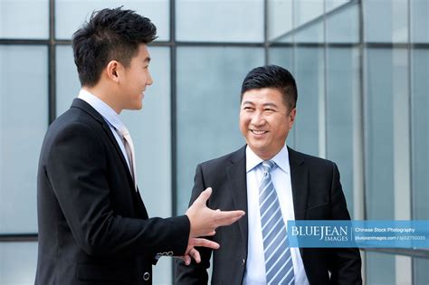 Smiling Chinese Businessmen High Res Stock Photo For Download