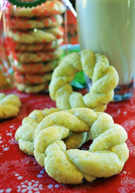Cookie dough balls are coated in walnuts then filled with lemon curd. 25 Days of Christmas Cookies- Lemon Cardamom Wreaths