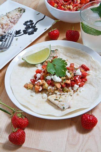 Put the strawberries in a bowl along with the onions, bell peppers, jalapenos and most of the cilantro, reserving some for garnish. Mojito Grilled Fish Tacos with Strawberry Salsa | Recipe ...