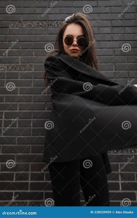 Fashion Model Comely Young Stylish Woman In Trendy Sunglasses In Jacket