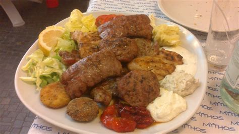 Greek Pikilia mixed grilled meat with three sauces and side salad