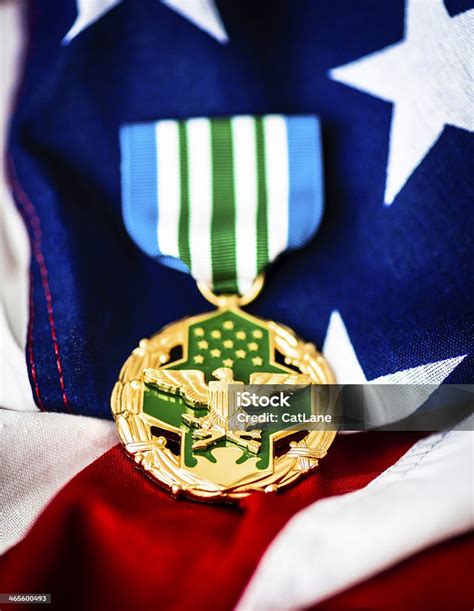 Military Joint Service Commendation Medal On American Flag Stock Photo