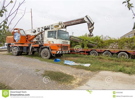Parked Mobile Crane And A Transport Vehicle Editorial Photography