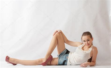 Smiling Blond Woman Shirt And Jeans Shorts Lying Stock Photo By Mettus