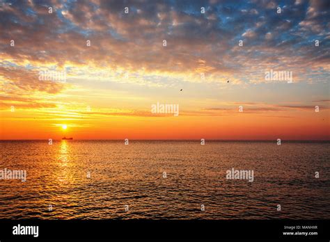 Beautiful Cloudscape Over The Sea Sunrise Shot Stock Photo Alamy