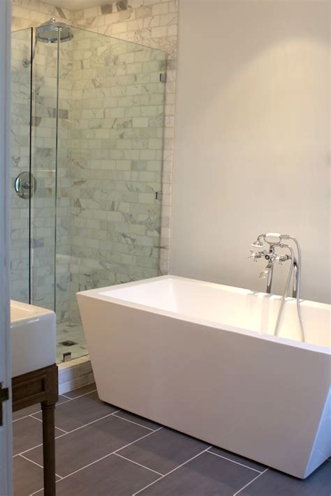 Many people want to replace a bath with a shower for one reason or another, but where accessibility is an issue, a level access shower area (often referred to as a wet room) may be better suited than a shower tray & enclosure as there is no step up into the showering area. Modern Freestanding Tub - Modern - bathroom - Kishani Perera