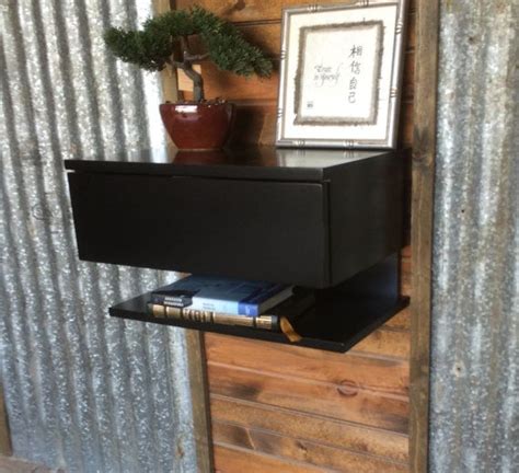The wooden nightstand is available in three finishes, including black, walnut, and rustic brown. Black Laquer Floating Nightstand with Push by ...