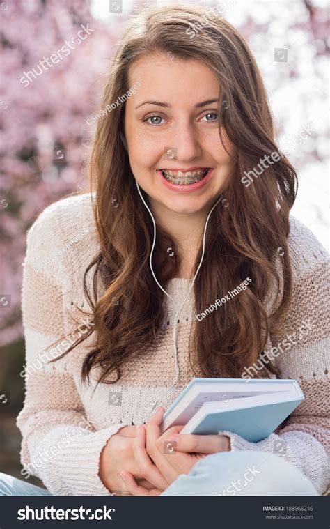 Happy Teenage Student Braces Holding Book Stock Photo 188966246