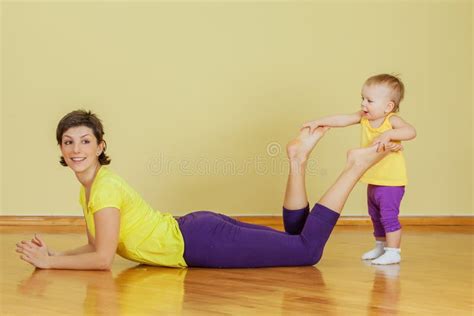 mother do phisical exercises with her daughter at home stock image image of healthy cheerful