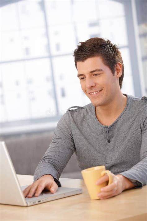 Smiling Guy Using Laptop Computer Royalty Free Stock Photos Image