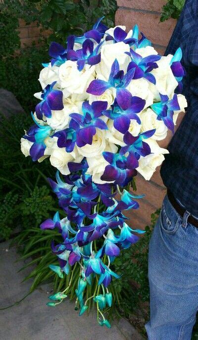 cascade wedding bouquet blue purple dendrobium orchids and white roses blue orchid wedding