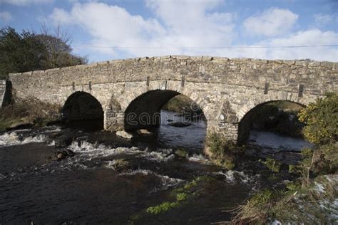 English River With Old Stone Bridge On Dartmoor England Uk Stock Photo