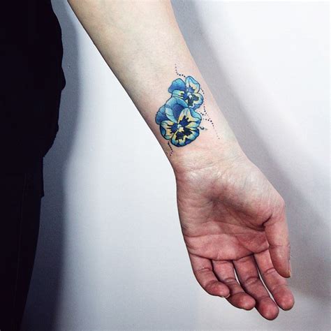 Flower wrist tattoos cannot be made too big, first of all because of the fact that there is no sufficient space to create a wrist tattoo design that will be big. Heartsease Tattoo on Wrist | Best Tattoo Ideas Gallery